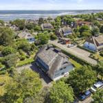 Village with thatched houses by the water