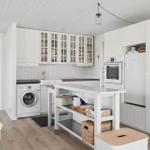 Kitchen with white cabinets, washing machine, and kitchen island
