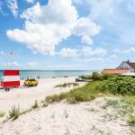 Beach house with sea view, sand dunes, and red roof