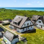 Häuser mit Garten und Blick auf das Meer