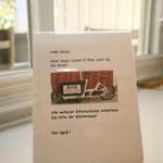 A sign informs guests about a cargo e-bike available for them.