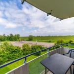 Balkon mit Gartenmöbeln im sihi220, Hus Inselkieker, Mellumweg 6b in Schillig
