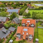 High-quality vacation apartment with view of the harbor and green surroundings.