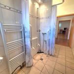 Shower with curtain and grab bar, heater and floor drain
