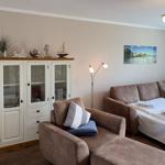 Living room with sofa, cabinet, and wall art