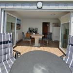 Apartment with kitchen, living area, bedrooms, bathroom, and balcony. Hall and stairwell are marked.