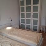 Bedroom with double bed, wardrobe, and nightstand