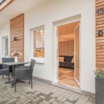 Entrance area with terrace, table, chairs, and view into the living room.