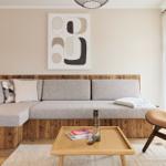 Ein Wohnzimmer mit einem grauen Sofa, einem Holztisch und einer modernen Wanddekoration.
