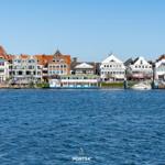 Harbor town with boats and houses by the water