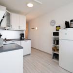 Kitchen with white cabinets, countertop, and appliances.