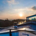 Roof terrace with sunset view over forest