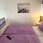 Bedroom with bed, TV, and wall picture