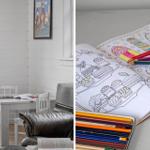 Childrens room with table, chairs, and a coloring book with colored pencils.