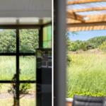 Durch Fensterblick auf grüne Wiese und Bäume. Links: farbiges Glasfenster. Rechts: Sicht unter Dachkonstruktion.