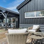 Deck with seating and view of the house.