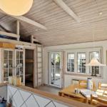 House with dining area, wooden ceiling, and bunk bed.