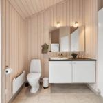 Bathroom with toilet, sink, and mirror on wood wall.