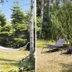 Hammock between trees and two chairs with table on grass.