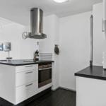 Kitchen with white countertop and stainless steel appliances