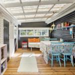 Deck with table and chairs, access to house via French doors.