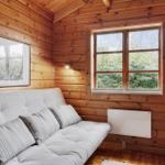 Wood-paneled hallway with closet, door, and sink with mirror.