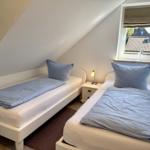 Schlafzimmer mit zwei Einzelbetten (die bei Bedarf zusammengeschoben werden können)