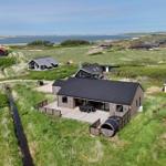 Holzhaus mit Terrasse und Blick auf die Nordsee