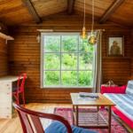 Apartment with kitchen, bathroom, and three bedrooms with beds.